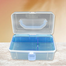 Open plastic storage case with various compartments for art supplies and cosmetics.